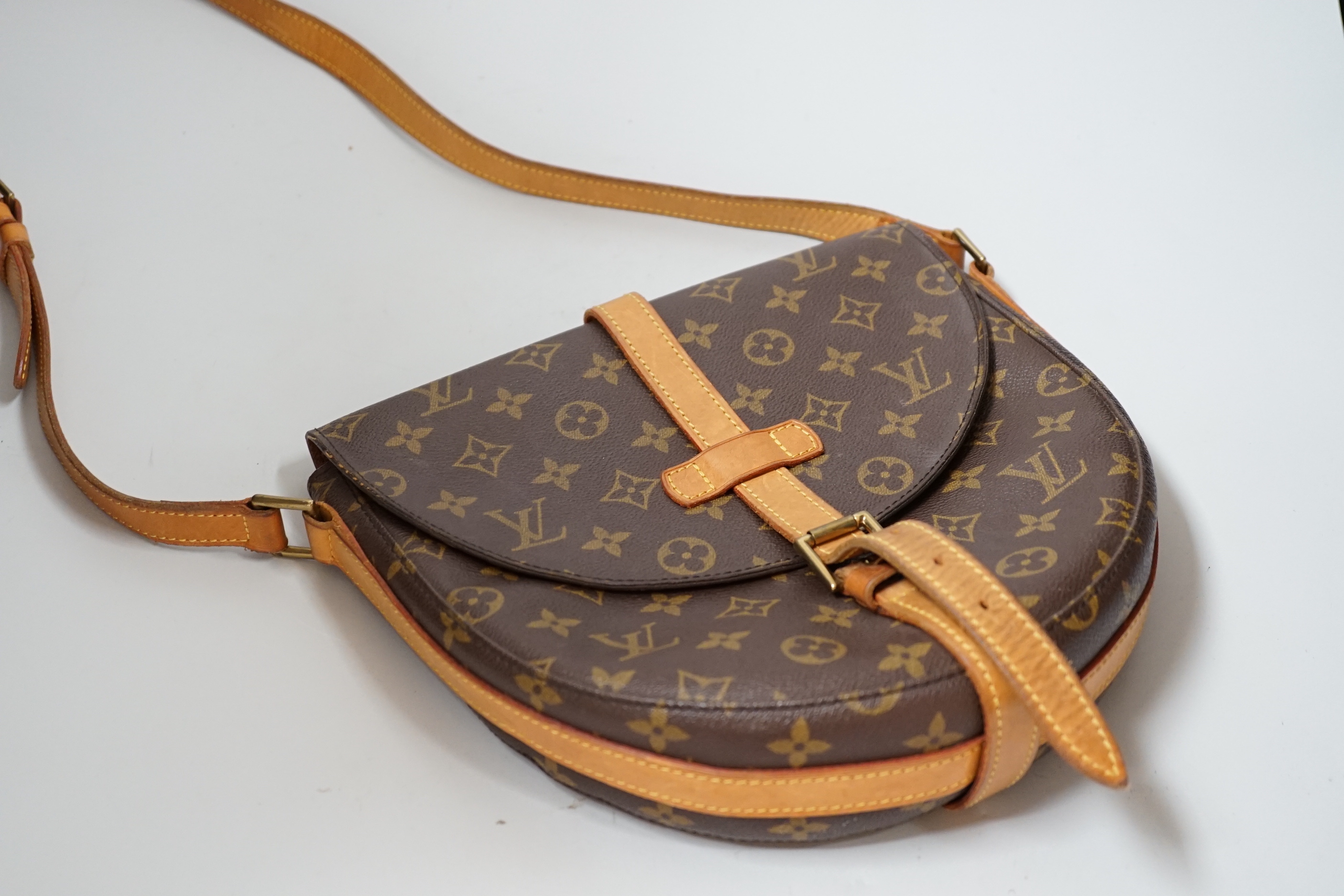 A Louis Vuitton lady’s handbag, horseshoe shaped, 28cm wide